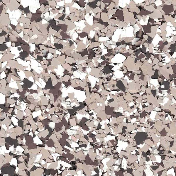 The image shows a cluttered array of irregularly shaped particles in varying shades of brown, black, and white, reminiscent of a terrazzo pattern.